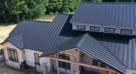 house with black metal roof|reflective black metal roof.